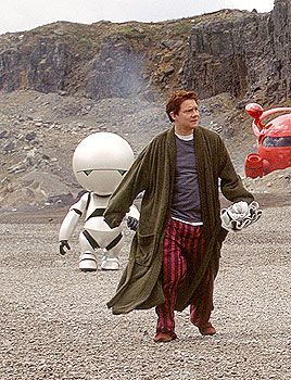 Martin Freeman as Arthur Dent with Marvin in the background